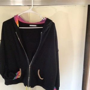 Black cotton cashmere hoodie with delightful rainbow colors as trim.